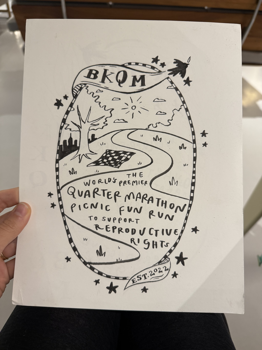 Original BKQM shirt drawing: a winding path, picnic blanket, and a run to support reproductive rights